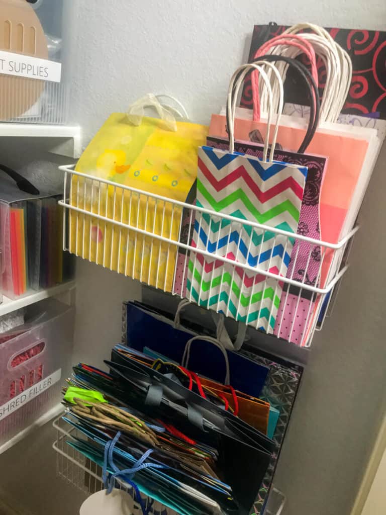 Gift bags neatly organized in an Elfa wall rack