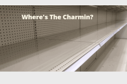 Empty grocery shelf with a tag saying "Where's the Charmin?'