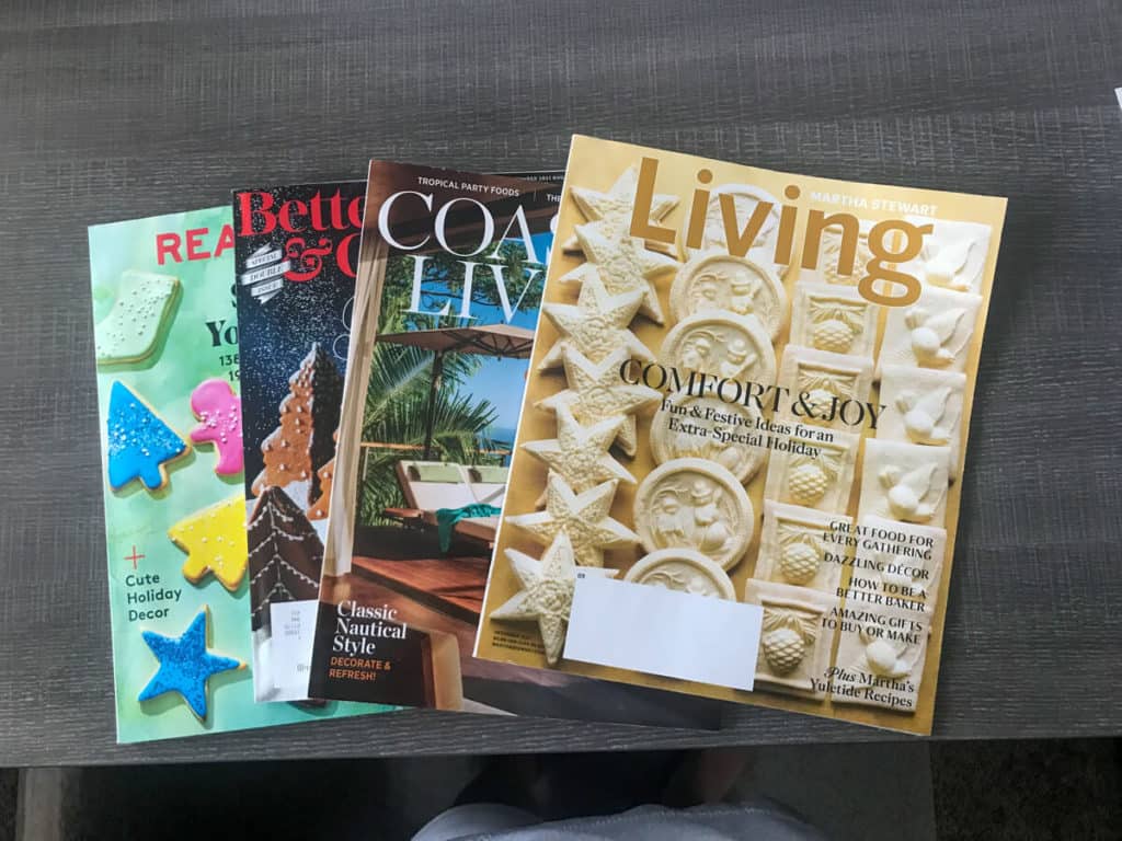 Magazines fanned out on a table to go along with the tip that sharing magazine subscriptions with others will save you money