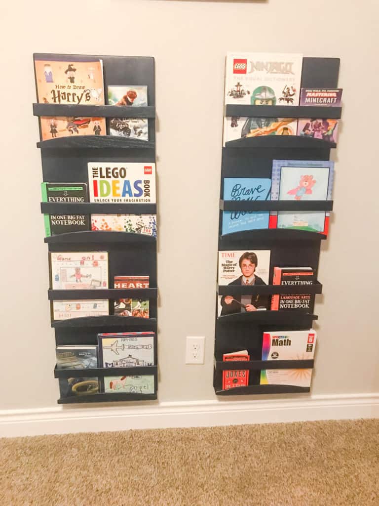 Organizing a kid's bedroom using bookshelves on wall