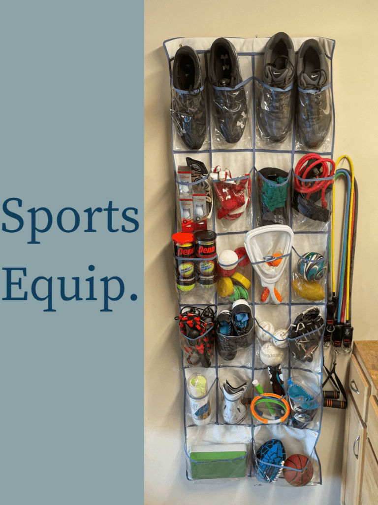 An over-the-door shoe organizer with each pocket filled with sports equipment