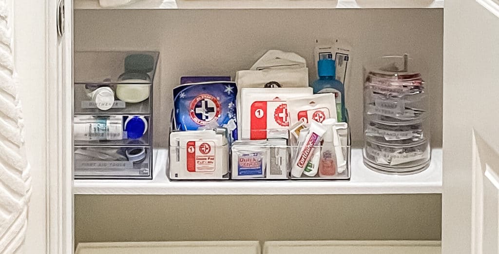 A plastic organizer filled with first-aid items