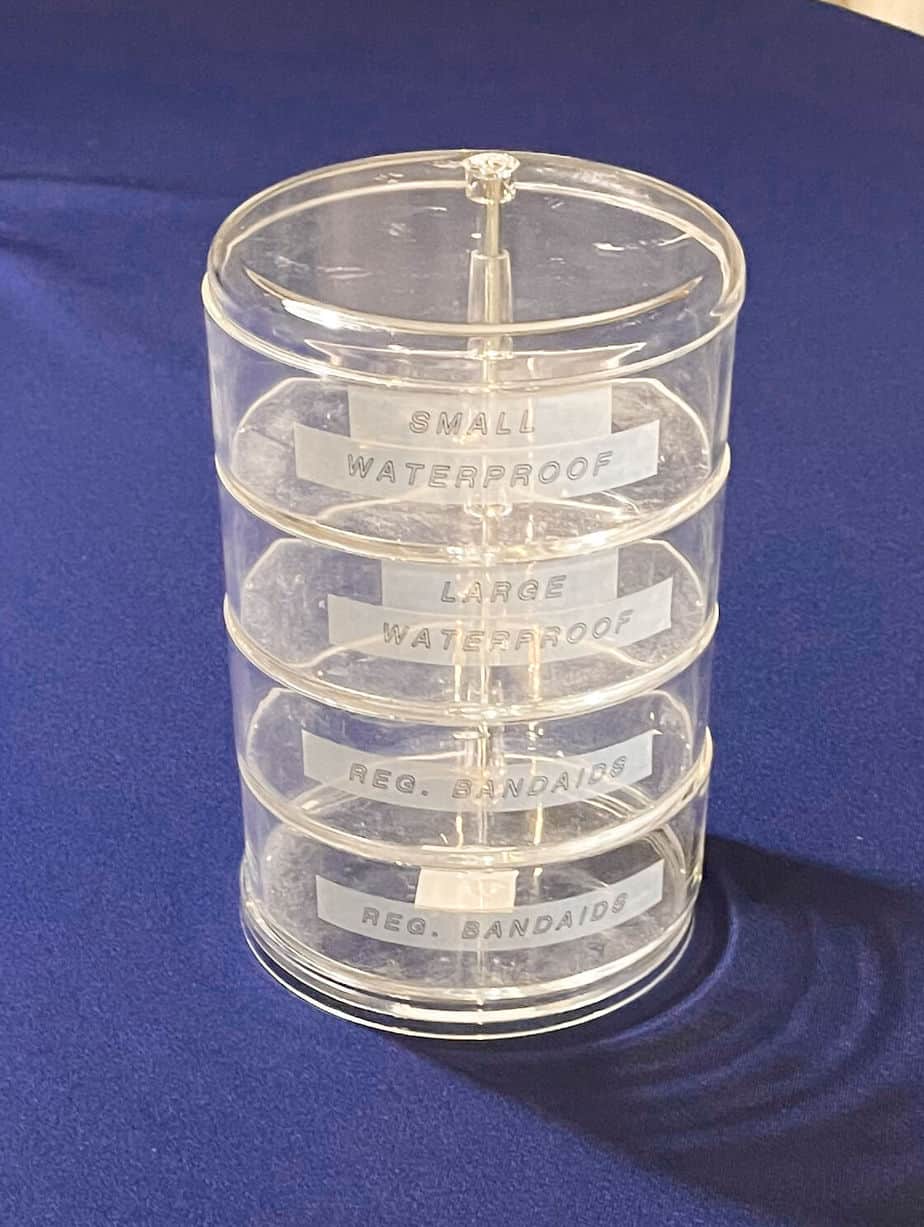 An acrylic swivel organizing container with 4 sections