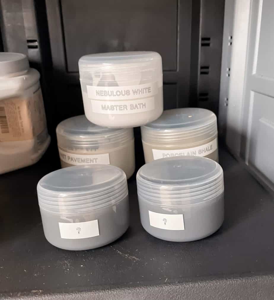 Small plastic containers holding sample sized amounts of paint