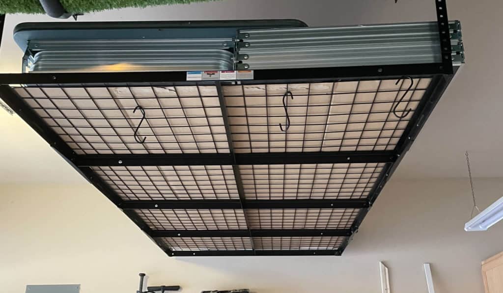 Ceiling mounted storage in a garage