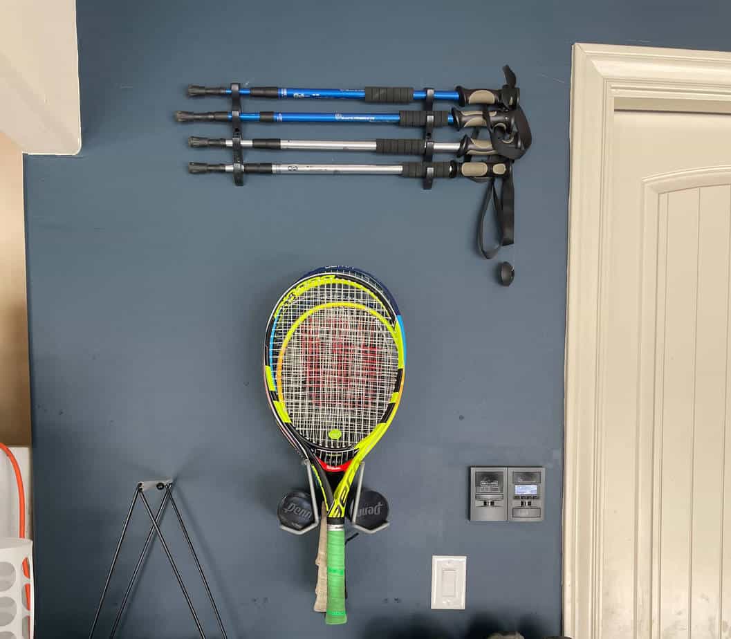 A garage wall with hooks and storage racks for sports equipment